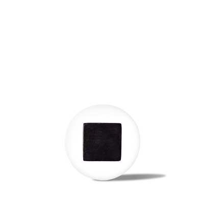 White pill with a black square imprint, medicine tablet for prescription or over-the-counter use.